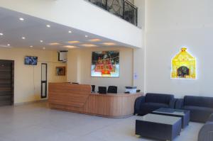 a waiting room with a reception desk in a hospital at The Fragrance Hotel in Katra