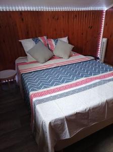 Un pat sau paturi într-o cameră la Villa Imelda à saint André la réunion