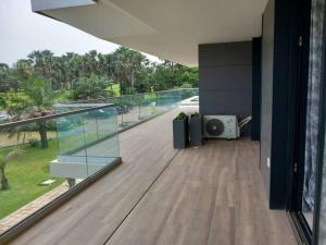 a balcony of a house with a view of the street at Prime Homes Gambia Luxury Apartment in Sere Kunda