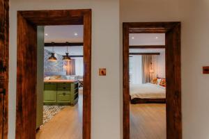 a room with a bedroom with a bed and a mirror at The Owl's Nest 2 in Velingrad