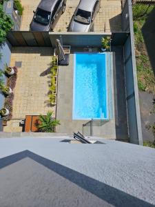 an overhead view of a swimming pool on a building at AP Villa Tourist Residence 16467 in Flic-en-Flac