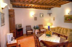 a living room with a couch and a table at Agriturismo L'Elce in Bolsena