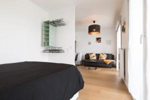 Ένα ή περισσότερα κρεβάτια σε δωμάτιο στο City Chic Apartment between Paris & Disneyland