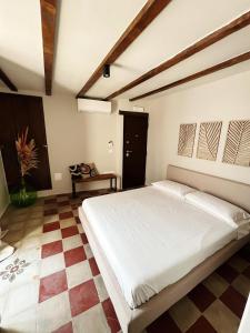 Postel nebo postele na pokoji v ubytování La Casetta b & b