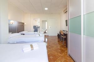 Hotel Sagunto客房内的一张或多张床位