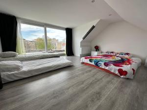 Postel nebo postele na pokoji v ubytování Dreamland Apartments EU, Brussels