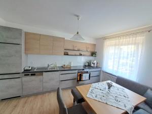 a kitchen with a table and a dining room at Ferienwohnung Josef in Steyr