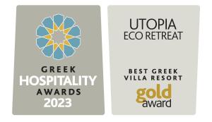 two signs for the new greek hospitality awards and the best green villa resort at Utopia Eco Retreat in Skiathos