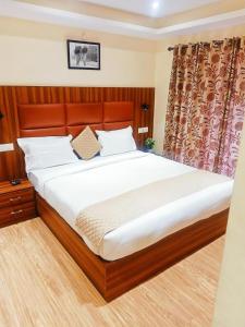 A bed or beds in a room at Himalayan view