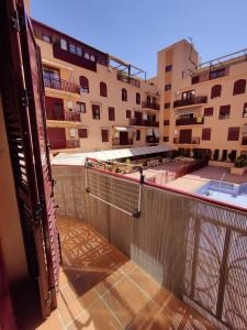a view from the balcony of a building at Apartamento, piscina y parking Granada Tico Medina in Granada