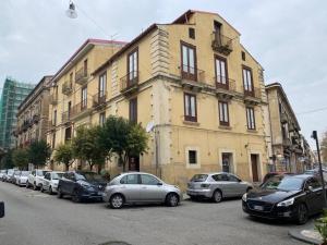 a group of cars parked in front of a building at Via Rivocati 108 in Cosenza