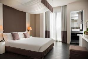 Postel nebo postele na pokoji v ubytování Hotel Ines