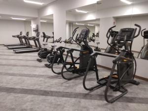 a row of exercise bikes in a gym at Livensa Living Studios Bilbao in Bilbao