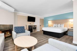 a hotel room with a bed and a fireplace at SureStay by Best Western San Francisco Marina District in San Francisco