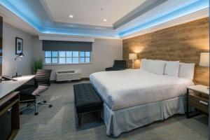 a hotel room with a bed and a desk at The Row Hotel; BW Signature Collection in San Jose