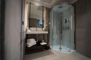 a bathroom with a shower and a sink at Best Western Plus Sabaudia Hotel in Sabaudia