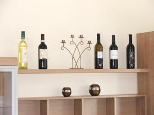 a bunch of wine bottles sitting on a shelf at Lea´s Apartment´s in Dortmund