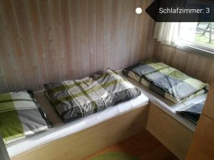 Postel nebo postele na pokoji v ubytování Ferienhaus Südsee 26