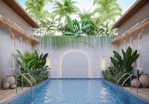 a swimming pool in a courtyard with palm trees at Sun Hotel and Resort, Mount Abu in Ābu Road