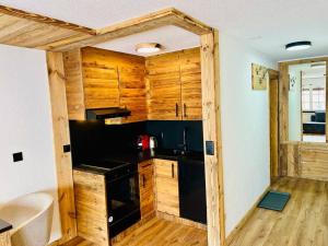 Kuchyň nebo kuchyňský kout v ubytování Chaleureux studio au centre