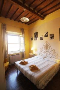 Postel nebo postele na pokoji v ubytování suite tra i tetti con bagno privato