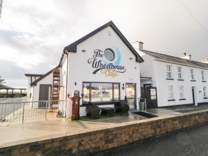 a building with a fire hydrant in front of it at The Wheelhouse Pod No 8 in Letterkenny +7 photos