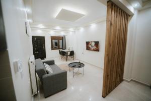 a living room with a couch and a table at Panorama Apartment in Kozani