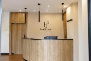 an office lobby with a reception desk and a sign that reads houston is rising at San Pedro Hotel & Restó in San Pedro +147 photos