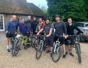 a group of men posing for a picture with their bikes at The Red Lion in Blewbury