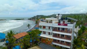 a view of the beach from a building at tippys beach resort in Trivandrum