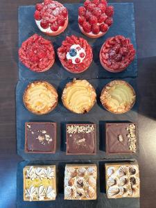 a bunch of different types of desserts on a table at Best Western Plus Thionville Centre in Thionville