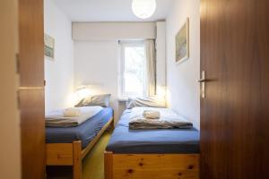 Postel nebo postele na pokoji v ubytování Brentschpark Wohnung 72 + 19 fotografií