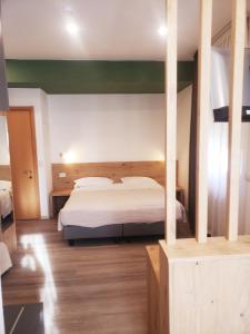 Posteľ alebo postele v izbe v ubytovaní Hotel Cantaleone