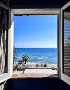 a view of the ocean from a window at Aeneas' Landing Resort in Gaeta