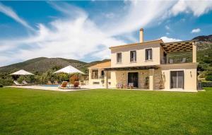 a house with a large yard with a pool at Splendid Kefalonia Villa - 3 Bedrooms - Villa Mandola - Great Sea and Mountain Views - Trapezaki in Kefallonia