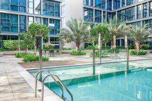 a swimming pool in the courtyard of a building at HiGuests - Magnificent Apt with Panoramic Views All Around in Dubai