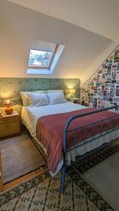 a bedroom with a large bed with a window at Casa do Paço Aveiro Studio&Rooms in Aveiro