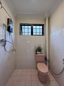 a bathroom with a toilet and a shower at D Riad Ipoh Homestay l Home Cinema l 300MBPS in Ipoh