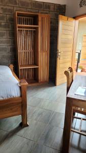 Postel nebo postele na pokoji v ubytování Babylon Lodge
