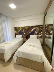 Cama ou camas em um quarto em Apartamento Ecoresort Capivari