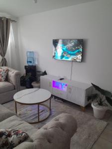 TV a/nebo společenská místnost v ubytování REMA AIRBNB'S