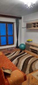 a living room with a zebra patterned rug at Apartament in Craiova