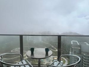 a table and chairs on the top of a building at Atmosphere De Genting in Genting Highlands