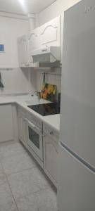 A kitchen or kitchenette at Albir cosy apartment