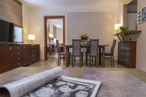 a living room with a table and a dining room at VacationClub - Bukowa 6B Apartament 26 in Wisła