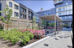 a garden with a pavilion in front of a building at Luxury Properties in Toronto Downtown Core in Toronto