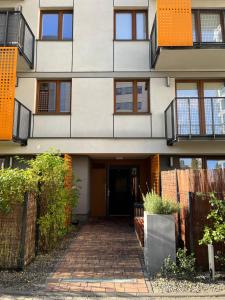 a building with a walkway in front of it at cybernetyki2 street INN near airport in Warsaw +7 photos