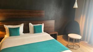 Postel nebo postele na pokoji v ubytování Yto boutique Hotel