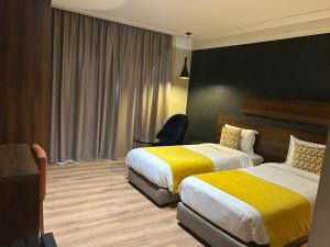 Postel nebo postele na pokoji v ubytování Yto boutique Hotel