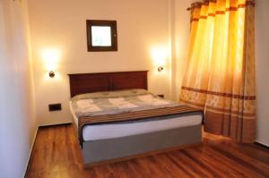 Postel nebo postele na pokoji v ubytování Asantha Guest House